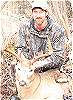 Bowhunter with Saskatchewan Buck taken Archery Hunting